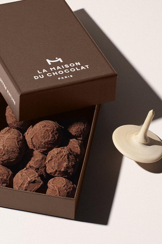 An open chocolate truffles gift box